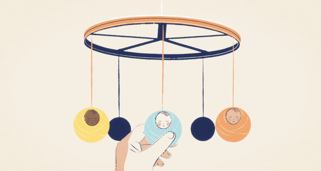 A hand gently touches a baby mobile with hanging swaddled infants of different skin tones, symbolizing care, diversity, and early childhood nurturing.