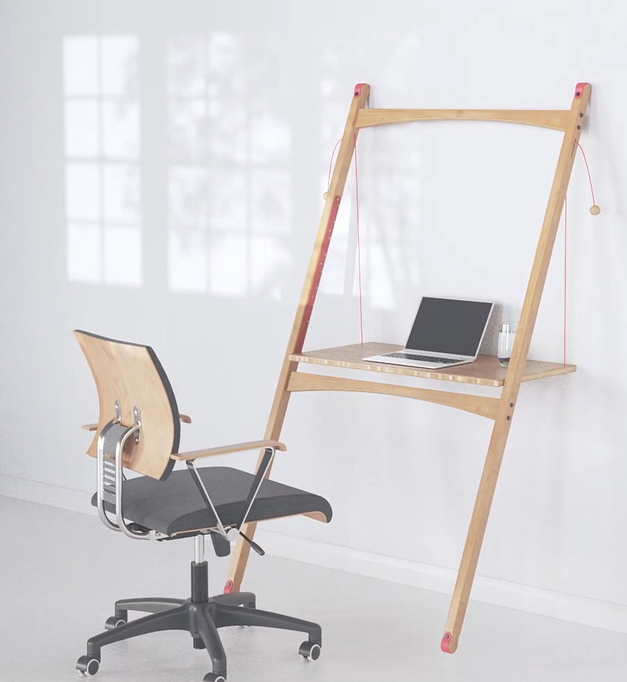 Minimalist leaning desk mounted on wall with laptop and glass, paired with a modern wooden office chair on casters, set in a bright, white room with window shadows.
