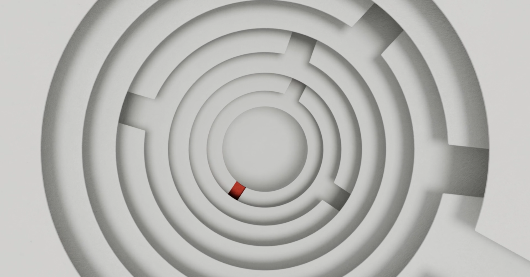 ChatGPT said: 3D abstract image of concentric circular pathways resembling a maze, with a single small red segment highlighting part of the inner ring, set against a light grey background.
