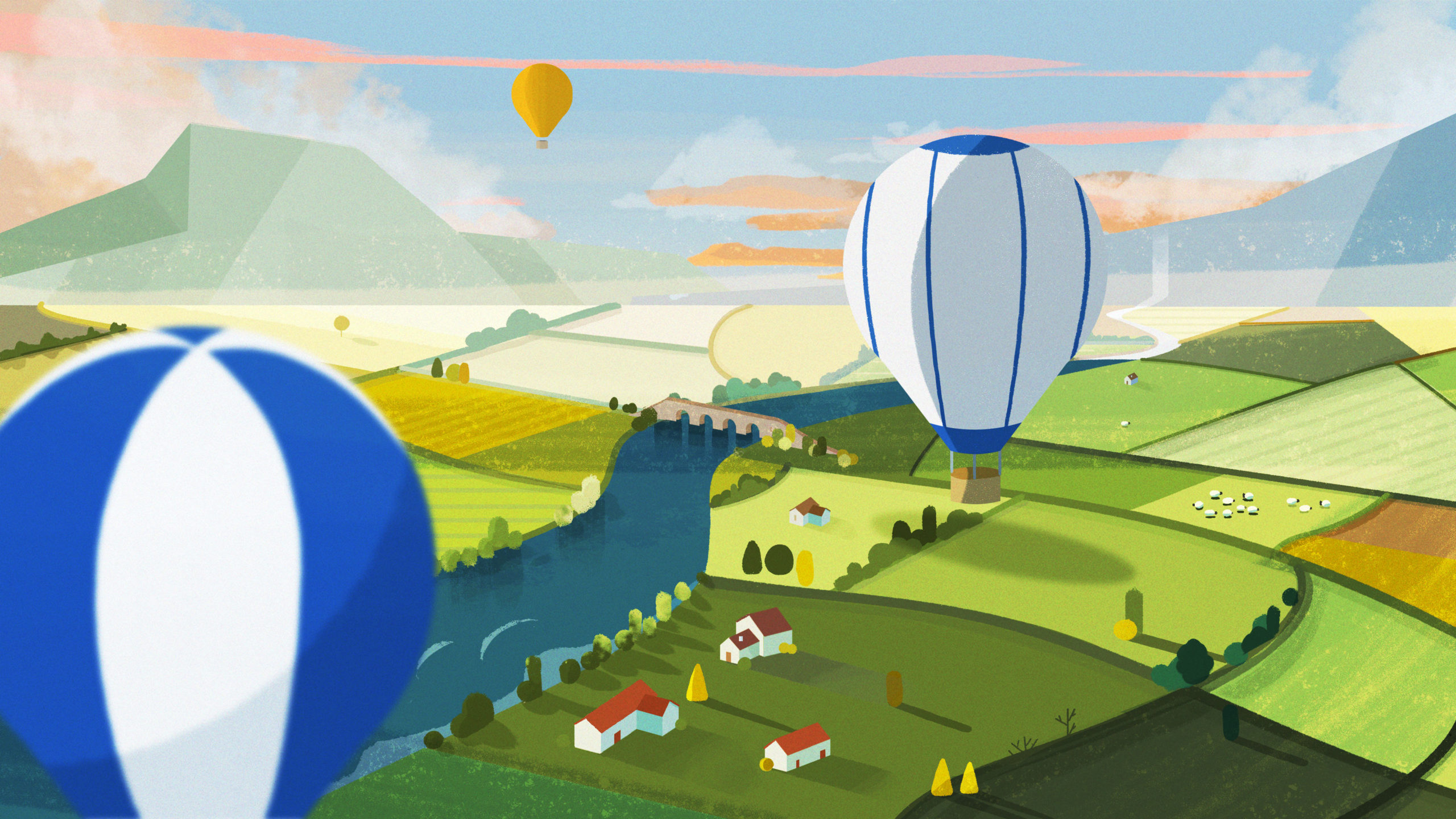 Colorful hot air balloons float above a picturesque countryside of rolling green fields, a winding river, scattered houses, and distant mountains under a soft, pastel sky.
