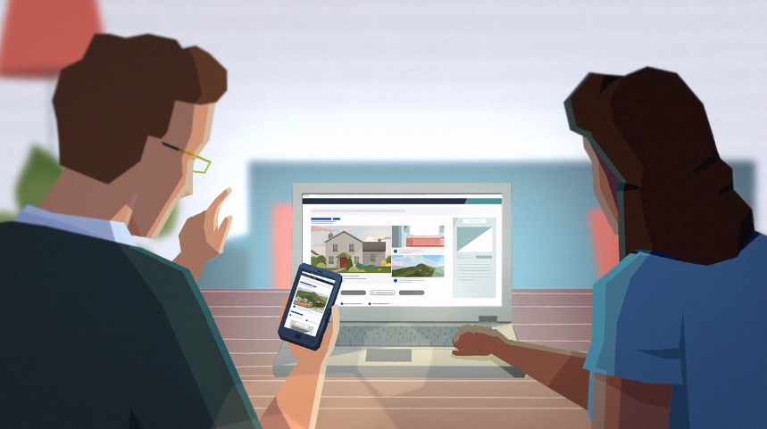 Two people review a travel website on a laptop and smartphone, examining vacation property listings and destination details, seated at a table in a bright, modern setting.