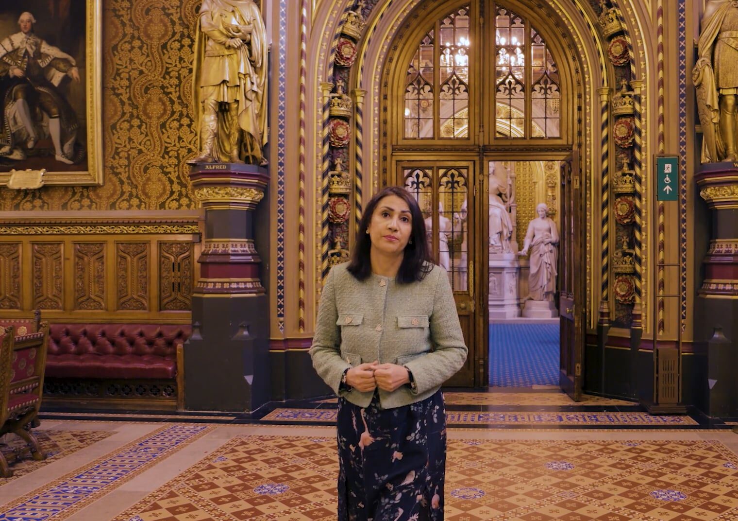 a photo of Baroness Gohir walking through the House of Lords Parliamentary chambers.