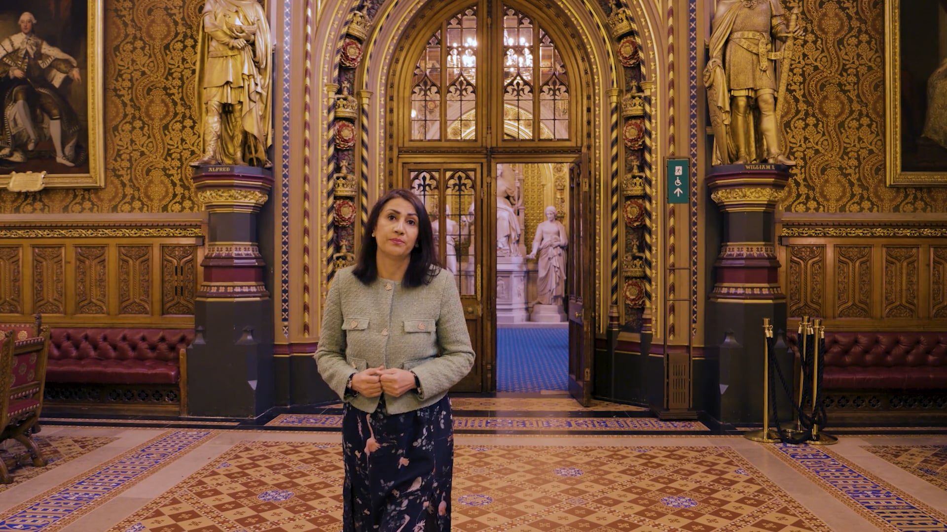 a photo of Baroness Gohir walking through the House of Lords Parliamentary chambers.